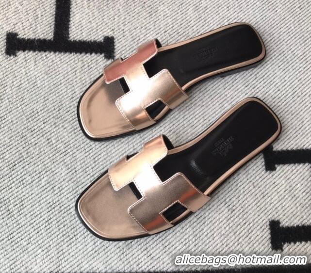 Luxurious Hermes Oran H Flat Slipper Sandals in Smooth Metallic Calfskin 1040297 Pink gold/Black