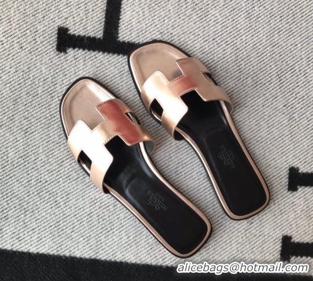 Luxurious Hermes Oran H Flat Slipper Sandals in Smooth Metallic Calfskin 1040297 Pink gold/Black