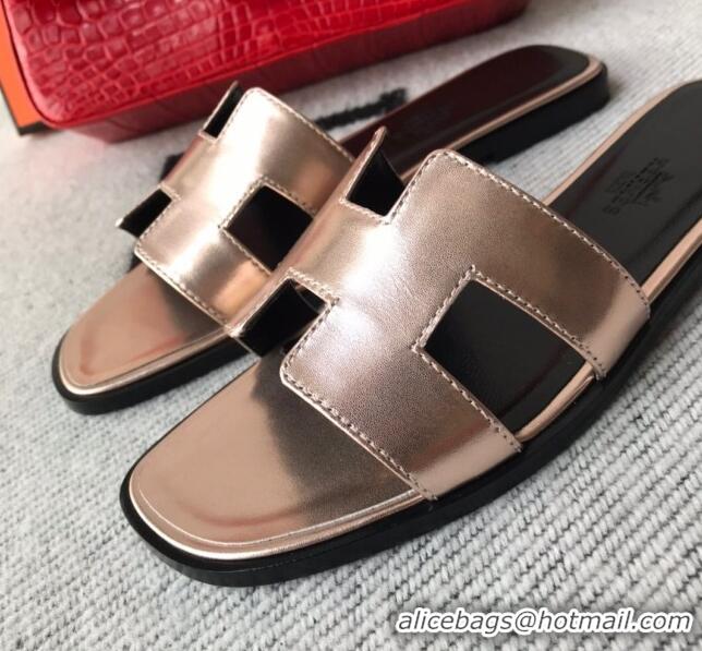 Luxurious Hermes Oran H Flat Slipper Sandals in Smooth Metallic Calfskin 1040297 Pink gold/Black