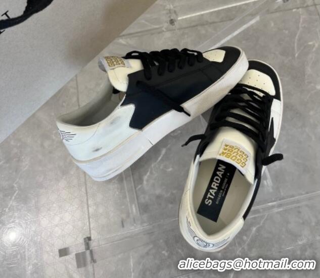 Luxurious Golden Goose Women’s Stardan sneakers with Black suede star in leather White 704027