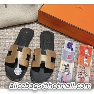 Luxurious Hermes Classic Oran Flat Slide Sandals in Palm Grained Leather Gold/Black 123055