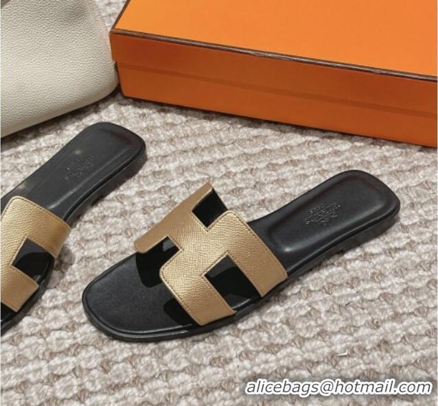 Luxurious Hermes Classic Oran Flat Slide Sandals in Palm Grained Leather Gold/Black 123055