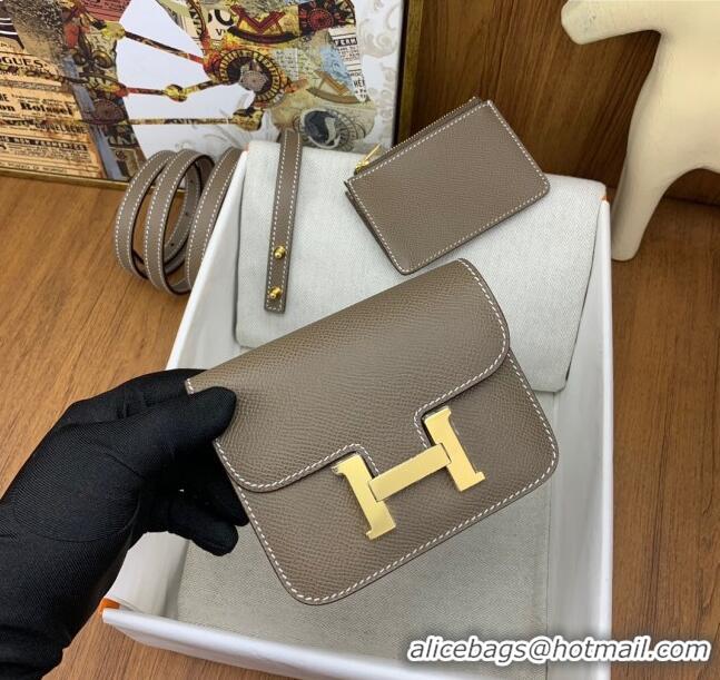 Grade Hermes Constance Slim Wallet with Leather Strap in Epsom Leather H0112 Etoupe/Gold 2024 (Half Handmade)