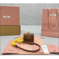 Good Taste Miu Miu Leather, cord, and metal trick with mini-pouch 5TL515 Yellow/Brown 2024