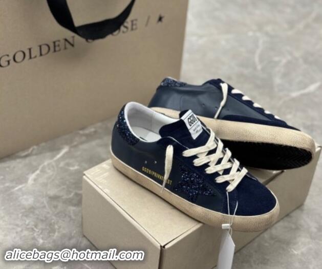 Stylish Golden Goose Women's Super-Star in navy blue nappa with black star and glitter heel tab 702118