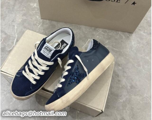 Stylish Golden Goose Women's Super-Star in navy blue nappa with black star and glitter heel tab 702118