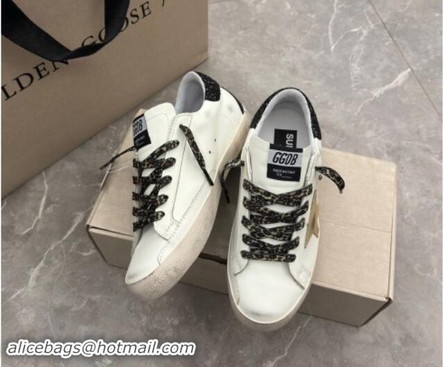 Best Product Golden Goose Super-Star Sneakers in white leather with black strass tab and gold star 1113003