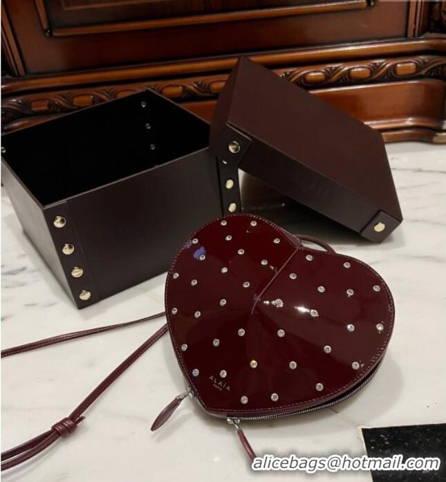 Best Price Alaia Le Cœur Heart Bag with Strass Stud Allover in Patent Leather 0621 Burgundy 2024